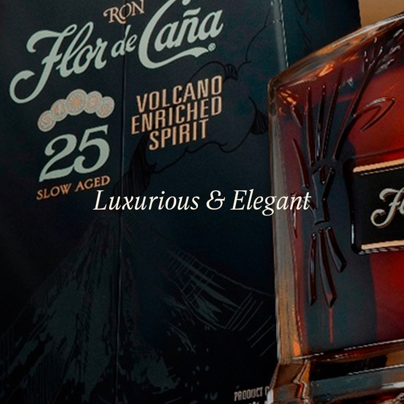 Flor de Caña rum bottle with packaging on a dark background