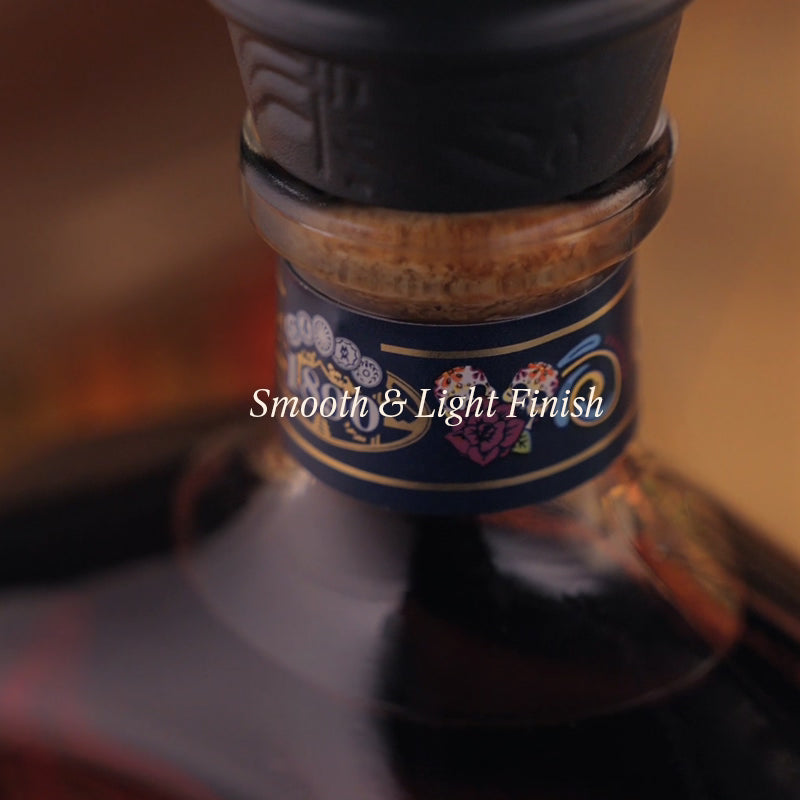 Bottle with a decorative label and 'Smooth & Light Finish' text on a blurred background