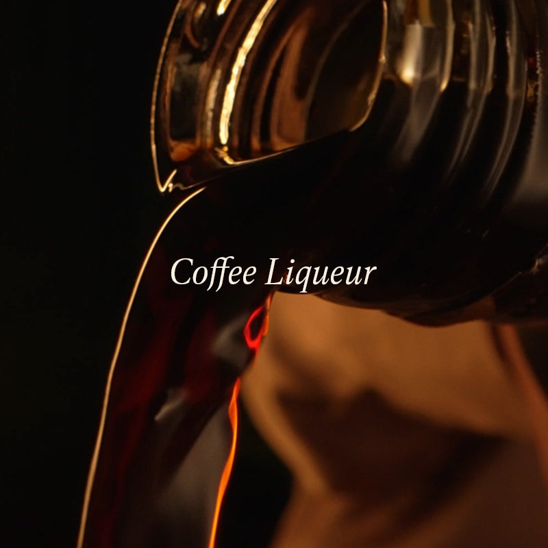 Coffee liqueur being poured with a dark background